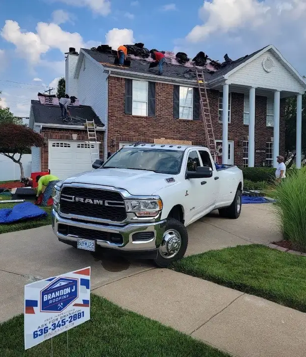 roofing contractors working on residential house in st peters mo