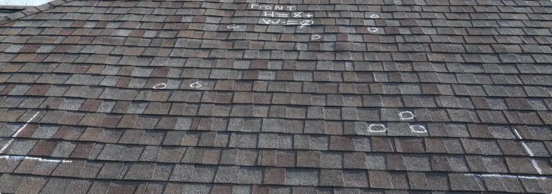 Roof shingles with chalk measurements and markings
