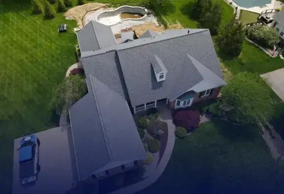 Aerial view of a residential home with a professionally installed asphalt shingle roof in St. Louis, Missouri
