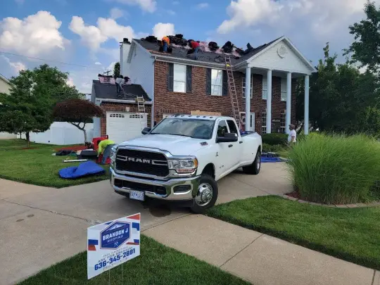 Brandon J Roofing professional team working on residential roof installation in St. Louis Metro