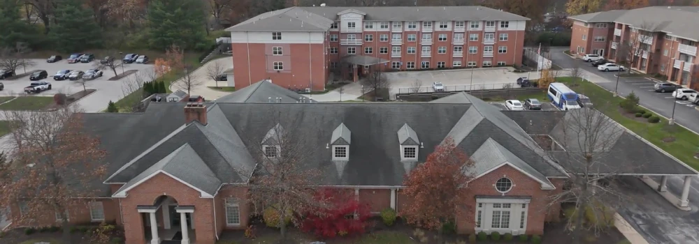 Aerial view of a residential building complex — before roof replacement